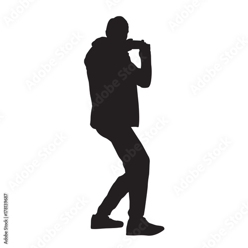 Man taking picture using mobile phone, vector silhouette photo