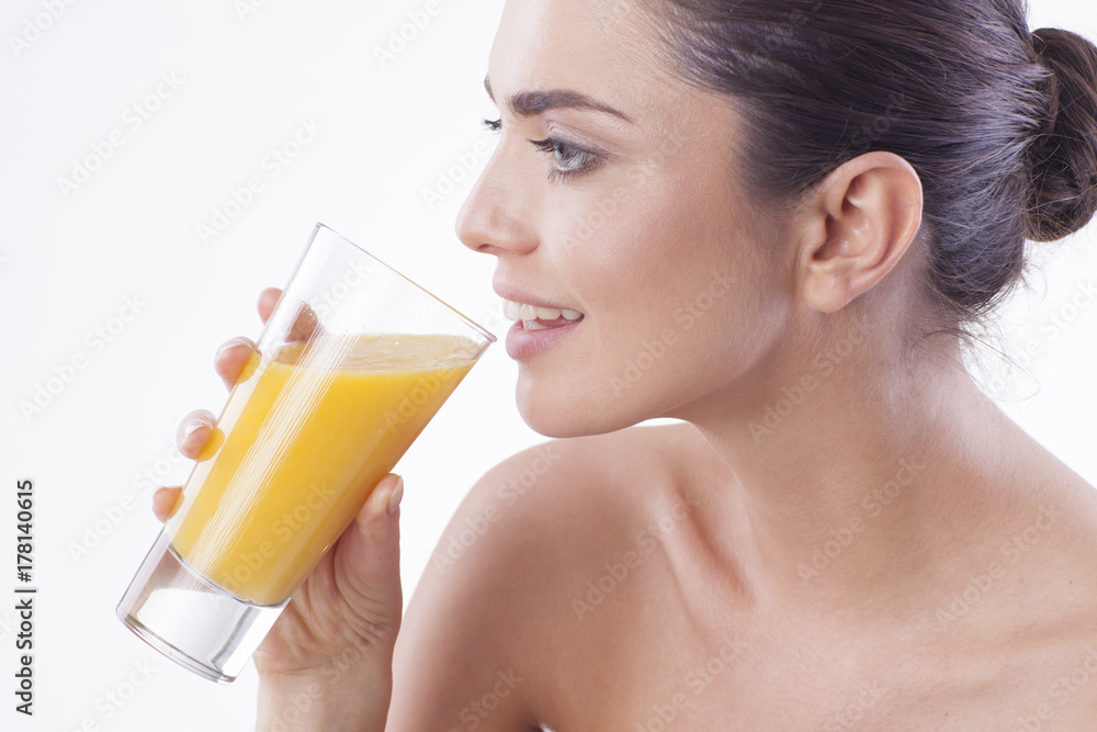 Smiling woman with orange juice. Smiling woman with orange juice.