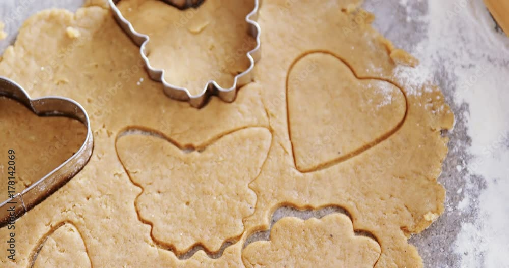 Gingerbread dough with flour and cookie cutter Gingerbread dough with flour and cookie cutter