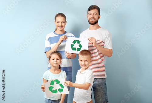 Family holding paper sheets...