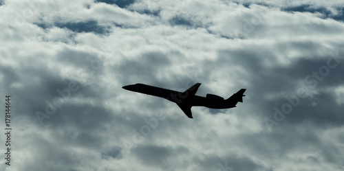 Jet Airplane Silhouette With White Cloud Background