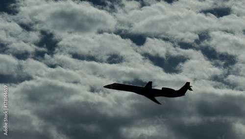 Jet Airplane Silhouette With White Cloud Background