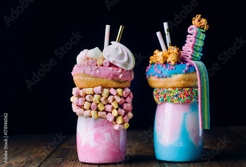 Konstfotografi Two freak shakes over black background with blank space for text