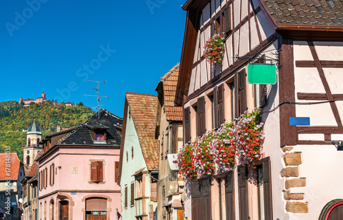 Saint-Hippolyte village with Haut-Koenigsbourg castle on top of a mountain - Alsace, France photo