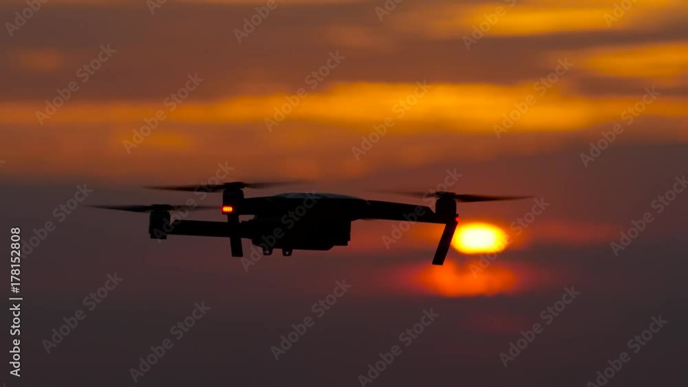 Copter flies, in the background a crimson sunset, he flies away Copter flies, in the background a crimson sunset, he flies away