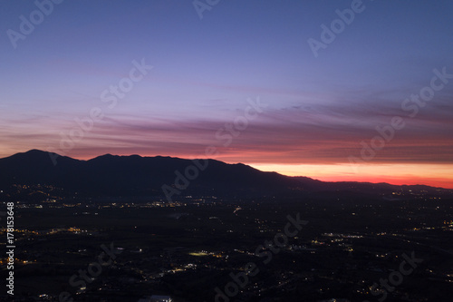 Aerial view of an incredible sunset behind the Italian mountains