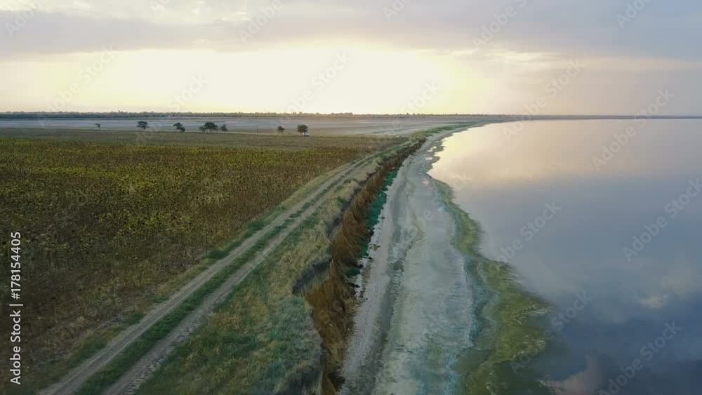 aerial view of beautiful lake in countryside during sunset aerial view of beautiful lake in countryside during sunset