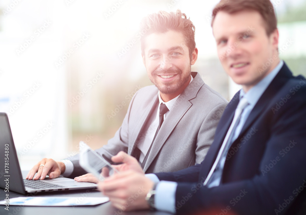 Image of two business people interacting at meeting in office Image of two business people interacting at meeting in office