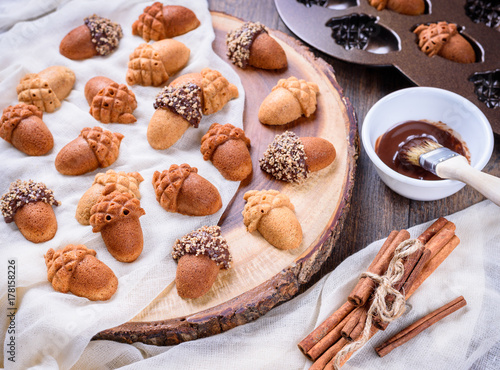 Wallpaper Mural Closeup of Maple Acorn Cakelets, acorn shape cookies on wood slice serving board, tray. Torontodigital.ca