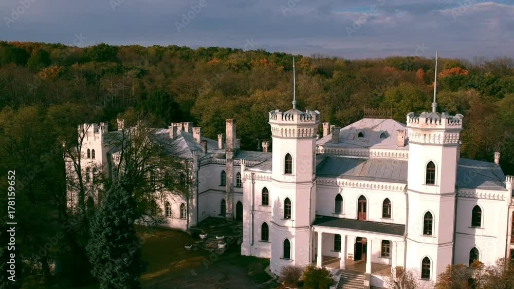 Aerial view on abandoned ruined castle and park. Autumn color footage in sunset light. Aerial view on abandoned ruined castle and park. Autumn color footage in sunset light.