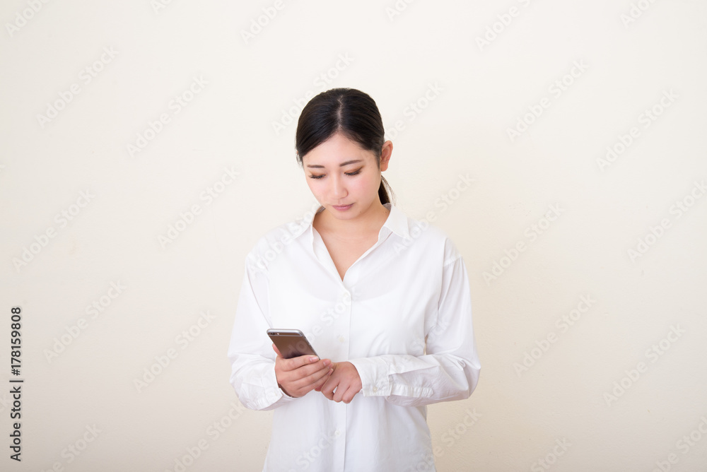 young asian woman using smart phone young asian woman using smart phone