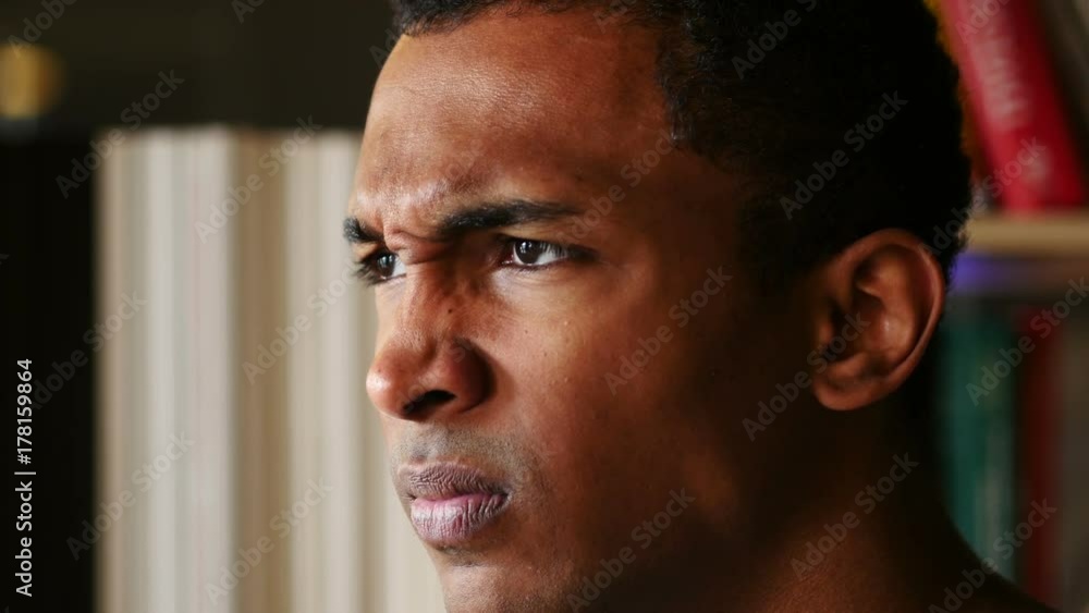Angry, Disappointed Afro-American Man, Face Close Up Side View Angry, Disappointed Afro-American Man, Face Close Up Side View