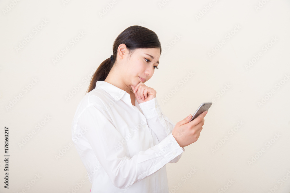 young asian woman using smart phone young asian woman using smart phone