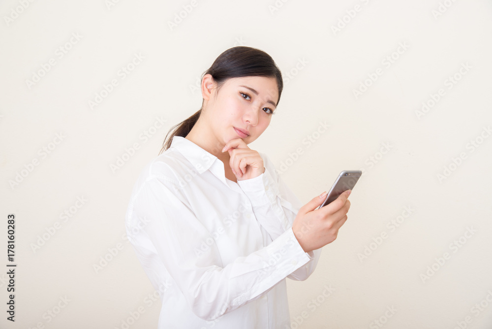 young asian woman using smart phone young asian woman using smart phone