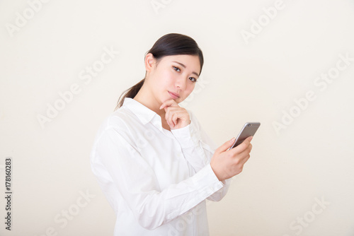 young asian woman using smart phone
