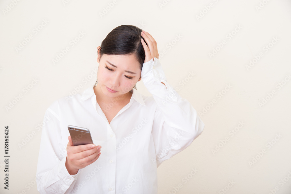 young asian woman using smart phone young asian woman using smart phone