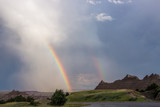 Double rainbow over Badlands National Park rock formations