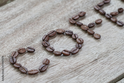 Coffee Bean Letter Word on Wood Grain Texture table