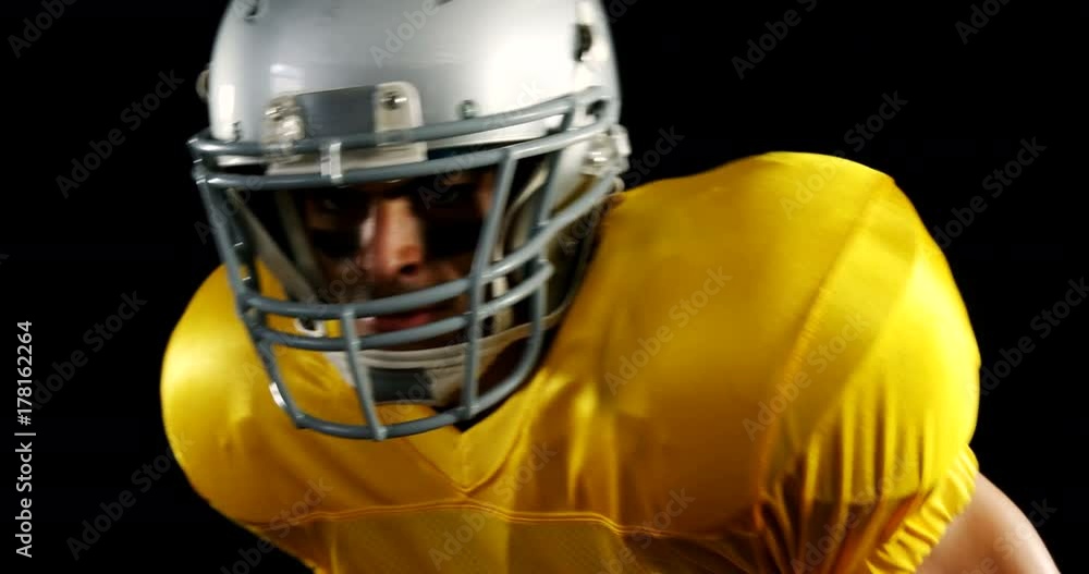 American football player running forward American football player running forward