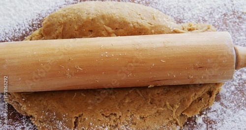 Flattened dough on a wooden table  photo