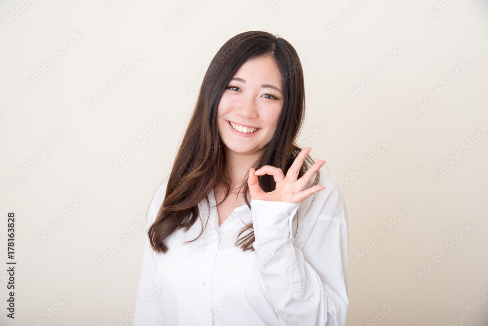 young asian woman with okay sign young asian woman with okay sign