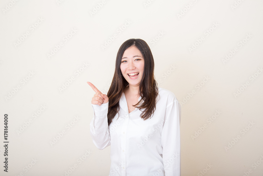 asian woman pointing with index finger asian woman pointing with index finger