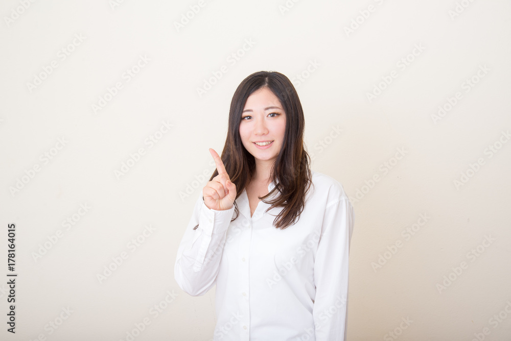 asian woman pointing with index finger