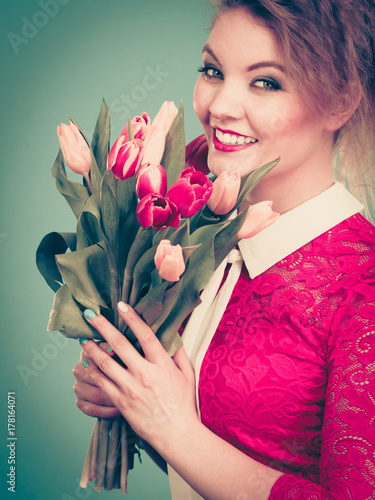 Woman holding bouquet of tulips flowers
