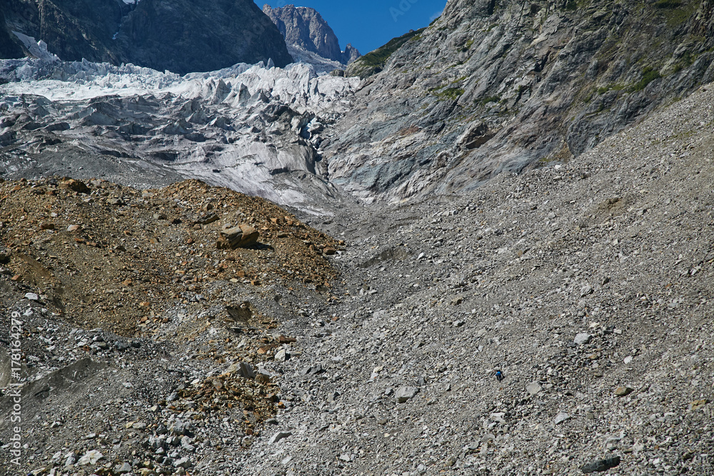 people go far beyond the rocks and stones to the glacier people go far beyond the rocks and stones to the glacier