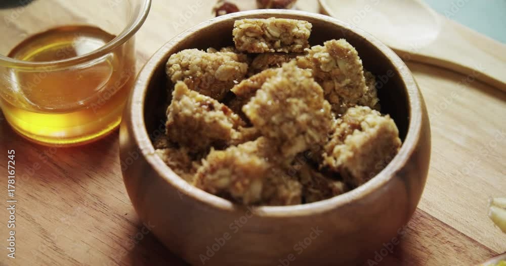 Granola bars in bowl with honey and fruits Granola bars in bowl with honey and fruits