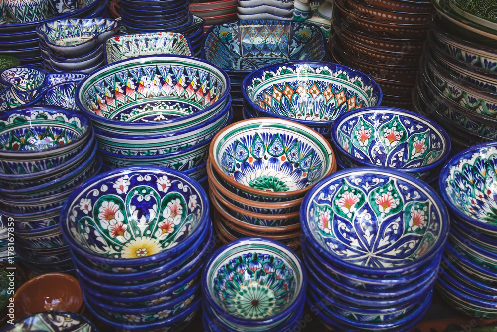Ethnic Uzbek ceramic tableware. Decorative ceramic cups with traditional uzbekistan ornament. Ethnic Uzbek ceramic tableware. Decorative ceramic cups with traditional uzbekistan ornament.