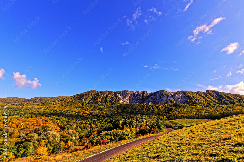 Beautiful autumn landscape at countryside with blue sky.