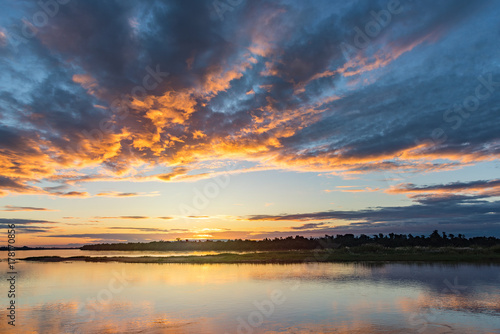 Sunset at the Mekong River look from Thailand to Laos. © akkaraks