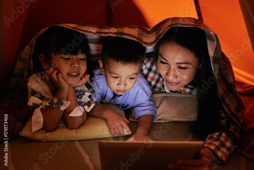 Family with tablet computer