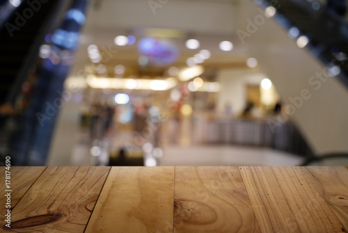 Wallpaper Mural Empty dark wooden table in front of abstract blurred background of cafe and coffee shop interior. can be used for display or montage your products Torontodigital.ca