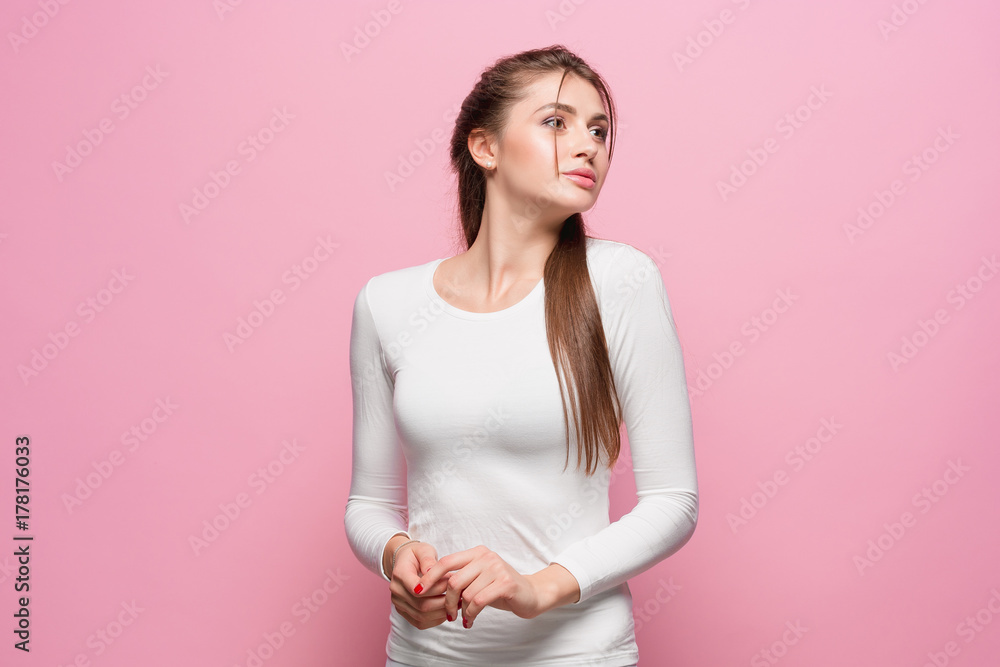 Fototapeta premium The young woman's portrait with thoughtful emotions