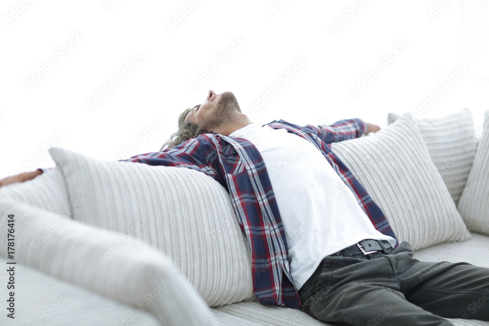 Obraz premium handsome successful guy resting on the couch.