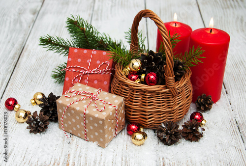 Christmas gift boxes and fir tree branch in basket