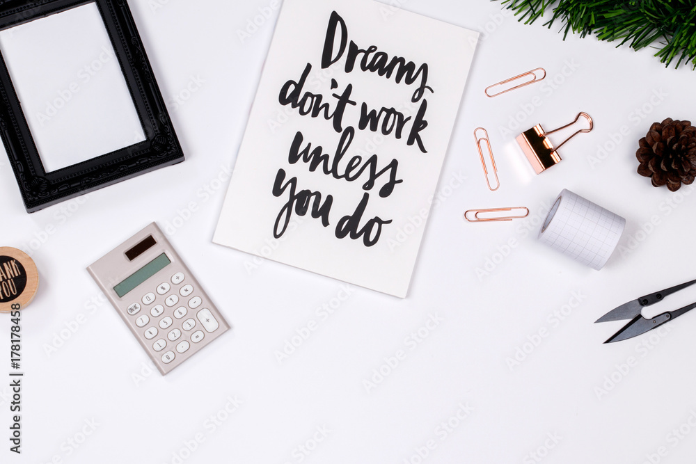 Plakat Home office desk workspace with laptop, quotes diary, golden paperclip, pine branches on white background. flat lay, top view