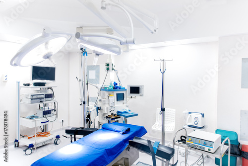 Medical devices and industrial lamps in surgery room of modern hospital. Interior hospital design concept