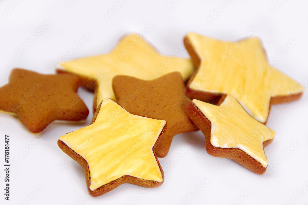 Ginger tasty gingerbread in the form of asterisks, isolated on white background.
Ginger tasty gingerbread in the form of asterisks, isolated on white background.