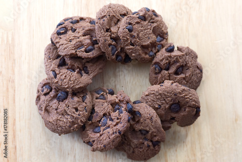 Chocolate cookies on wooden table. Chocolate chip cookies top view