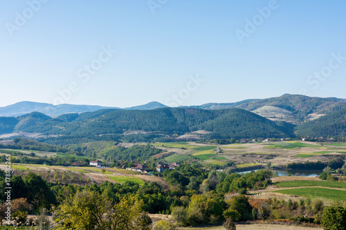 Fototapeta Naklejka Na Ścianę i Meble -  Country Side Landscape With Small Village In The Mountains