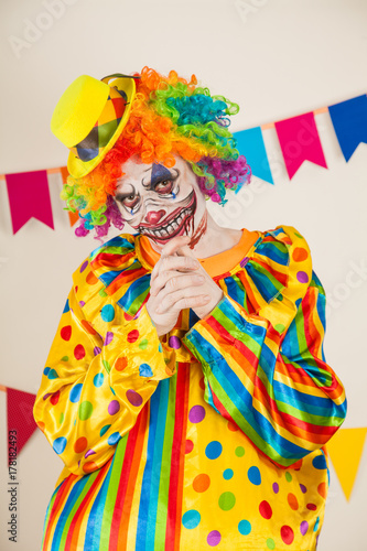 a terrible clown. Halloween. The crazy clown conceived something terrible
