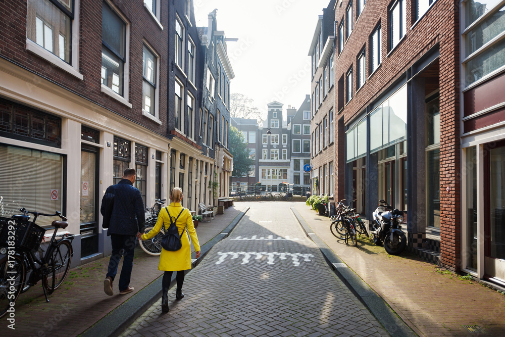 Fototapeta premium Walking by street of Amsterdam