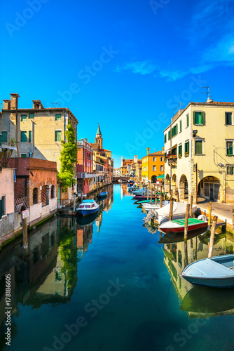 Chioggia town in venetian lagoon  water canal and church. Veneto  Italy