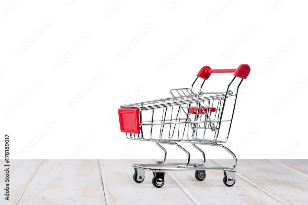 Shopping cart on a table with an isolated background Shopping cart on a table with an isolated background