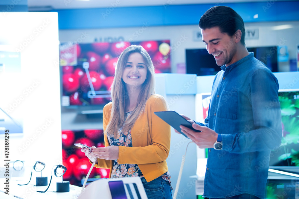 young people shopping for latest phone