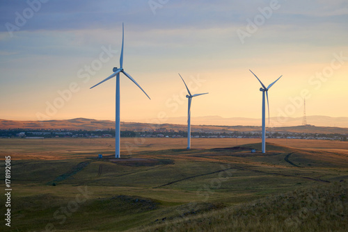 Wind power stations Wind power is the use of air flow through wind turbines to mechanically power generators for electric power. A wind farm is a group of wind turbines in the same location used for p