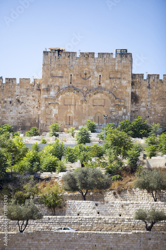 Unusual view of the Golden Gate in Jerusalem against a blue sky